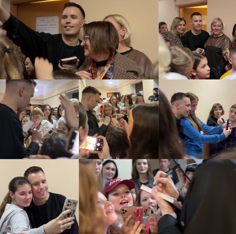 Yogen позує для фото з фанатами після концерту.